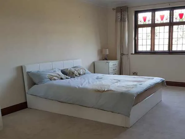 A bright bedroom at St Benets House