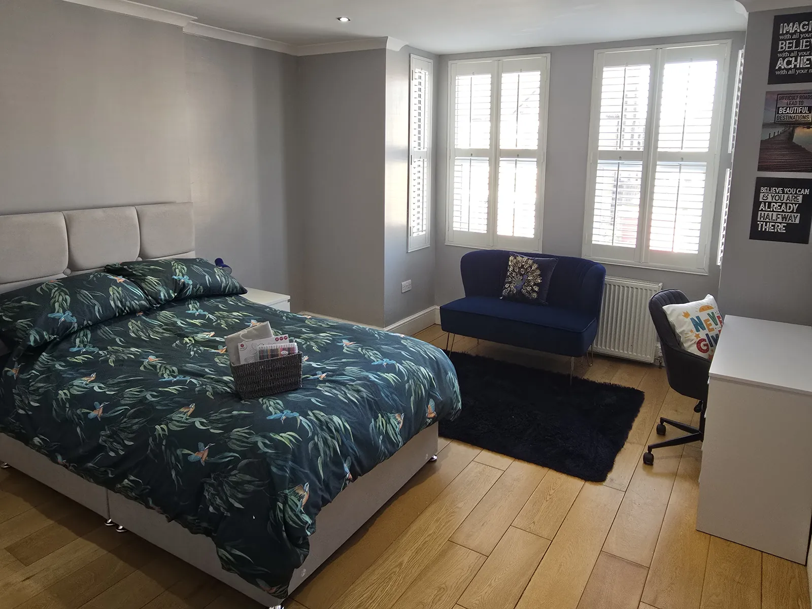 A bedroom at Sawadi House with shutters and a double bed
